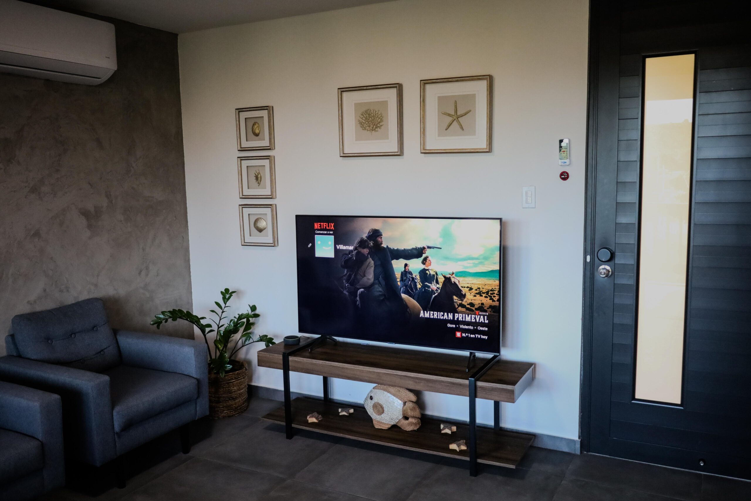 Living room with smart TV and seating area at VillaMar Fajardo vacation rental
